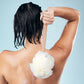 Wooden Long-Handled Bath Loofah in use
